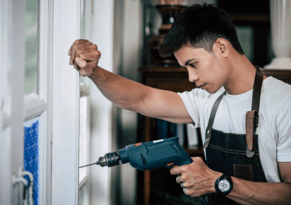 Worker repairing blinds